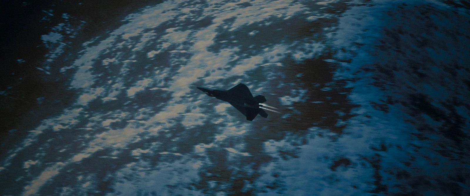 Aircraft flying over desert mountains