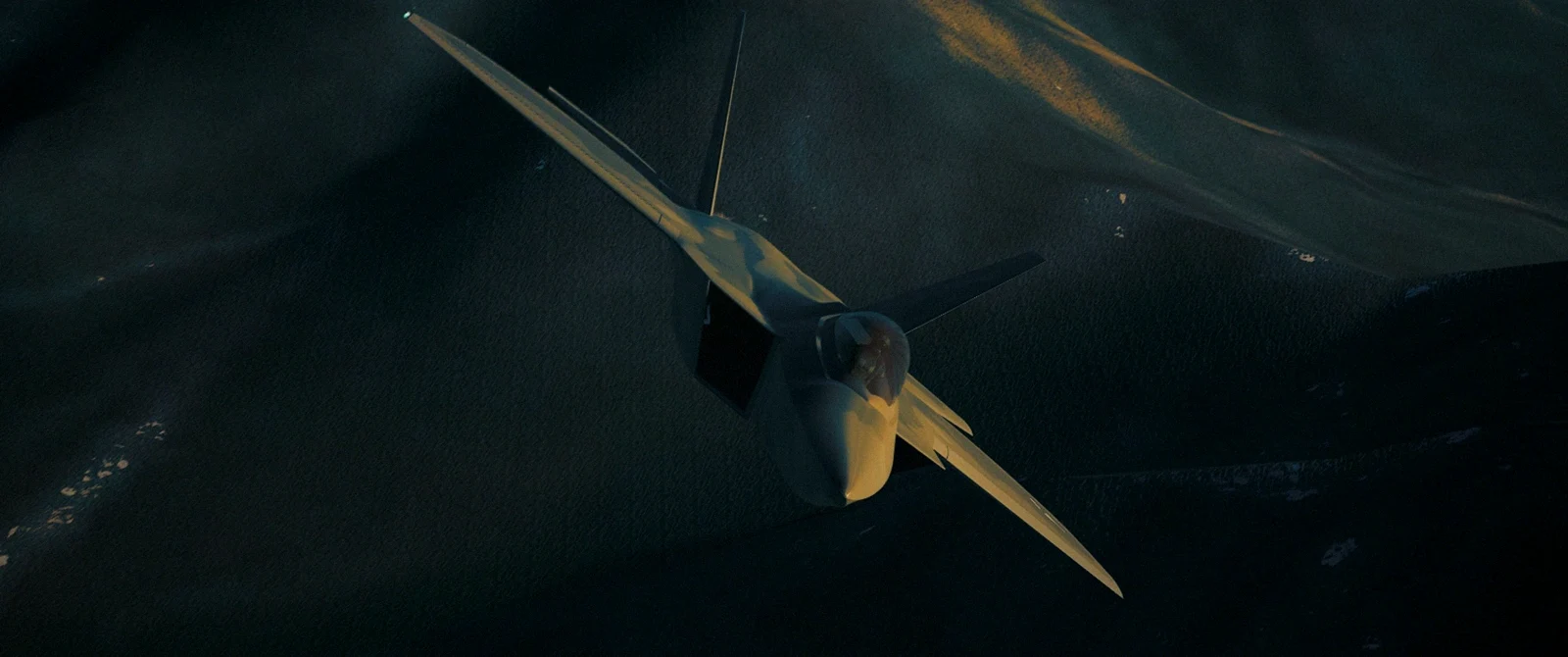 F-22 banking over mountainous terrain in SKYREIGN